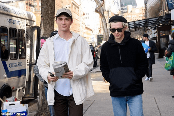 Sivan is spotted throwing out gifted bouquets in New York after greeting excited fans while with model boyfriend Jacob Bixenman