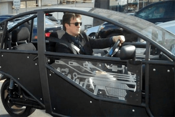 Nathan Fillion in his eco-car