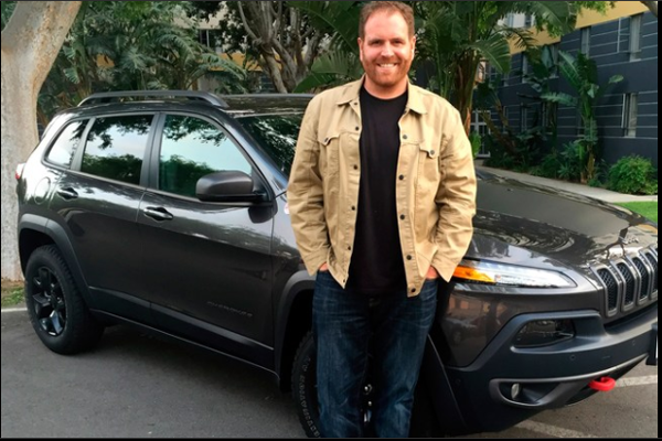 Josh Gates with his car