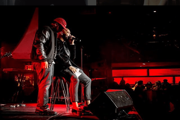 Joe Budden performing on the stage.