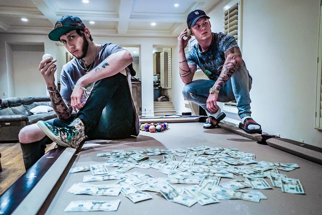 FaZe Banks posing with his money.