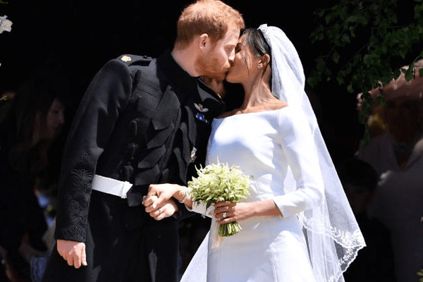 Prince Harry and Meghan Markle kiss as husband and wife