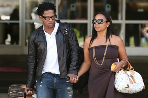 Ladonna and husband Hughley walking with hand on hand after long relationship marriage.