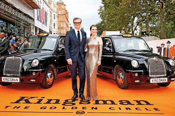 Colin Firth Net worth, Firth with his co-star Moore at his Film premiere