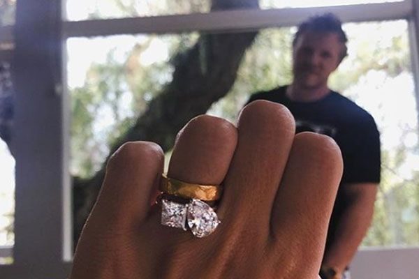 Emily shows off her engagement ring