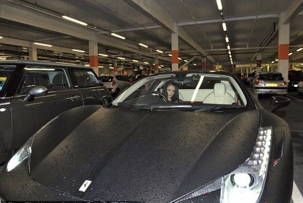 Jess Impiazzy in her black Ferrar.i