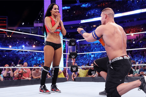 John Cena kneels down to propose to his girlfriend Nikki Bella at WrestleMania