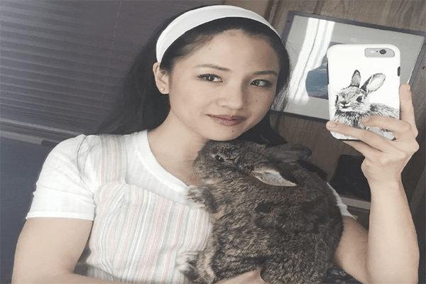 Constance Wu with her pet rabbit