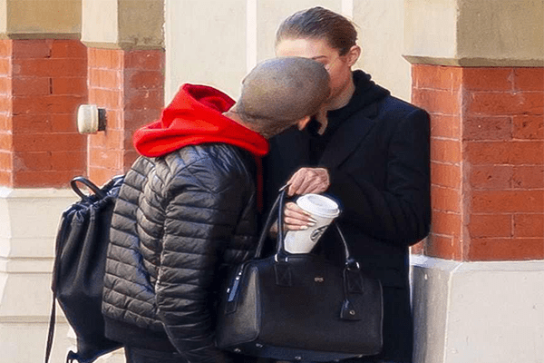 Zayn Malik and Gigi Hadid kissing.