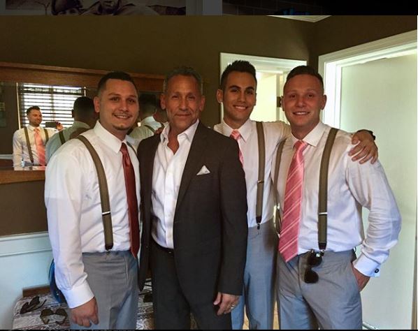 Angelo Pagan with his three son