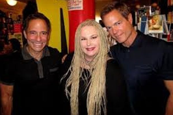 Harvey Levin and boyfriend with Associate. 