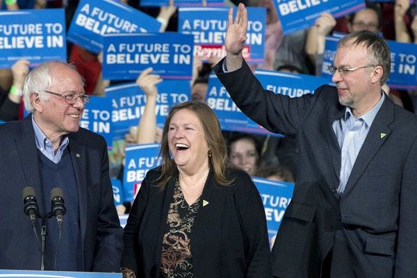 Levi Sanders with his father and stepmother