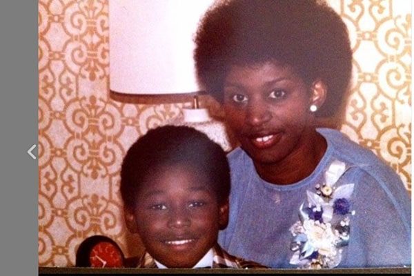 Adrian Holmes and his mother